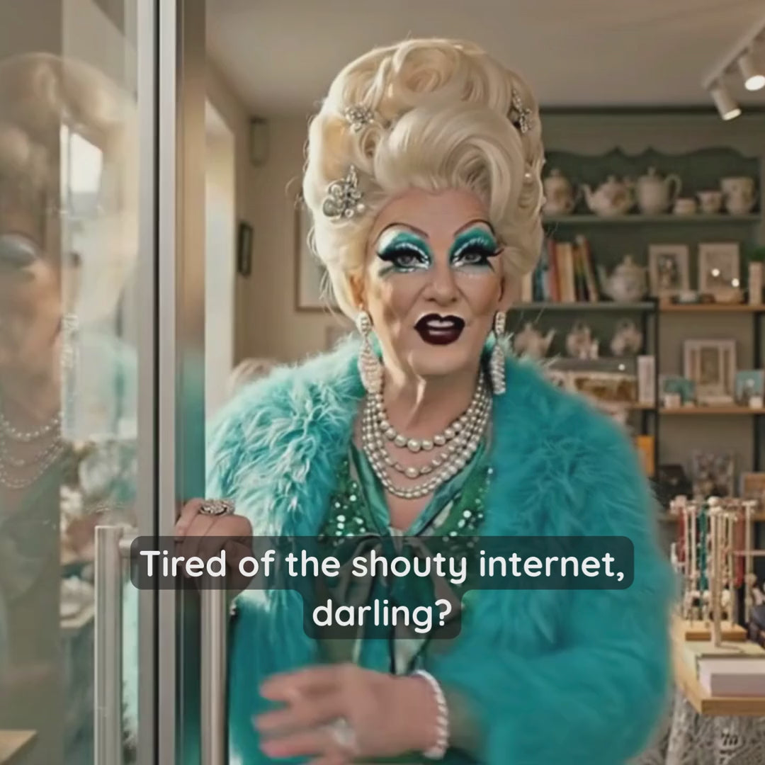 Load video: Join the fabulous Gilda Glitterwell in her sunlit sanctuary. She is dressed in her signature teal fur and green sequins. On-screen text invites viewers to leave the "shouty internet" behind and join her for a mooch.